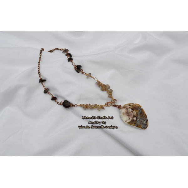 Sea shell pendant with rutilated and smokey quartz accent stones
