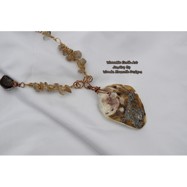 Sea shell pendant with rutilated and smokey quartz accent stones