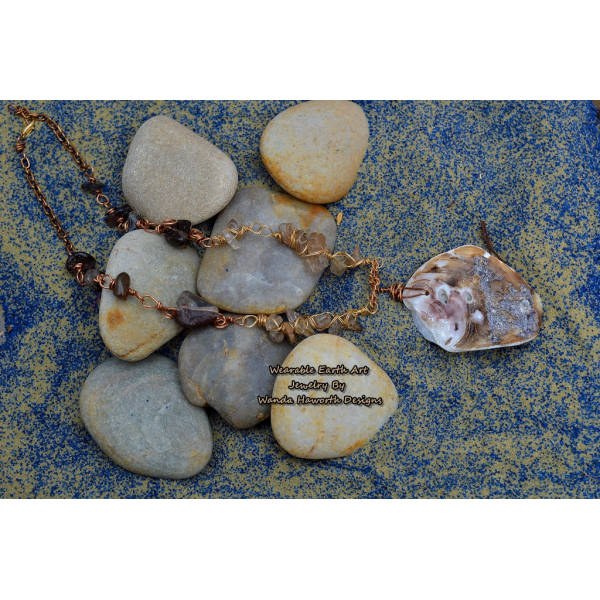 Sea shell pendant with rutilated and smokey quartz accent stones