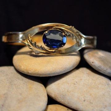Vintage jewelers brass bracelet , Center mounted faceted blue Swarovski crystal , Hinge closure , Excellent quality from the 1900's